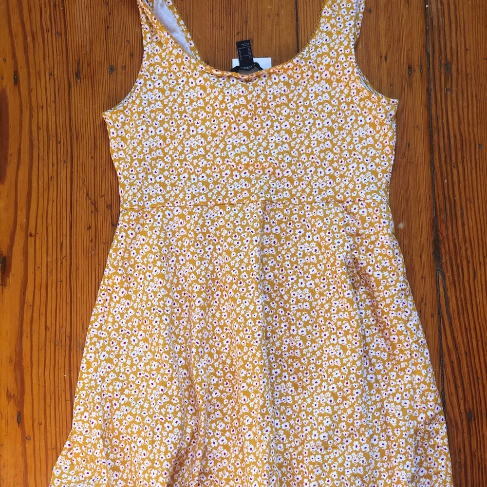 Cute dark yellow flowy dress with white flowers